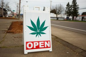 sign in front of a cannabis dispensary
