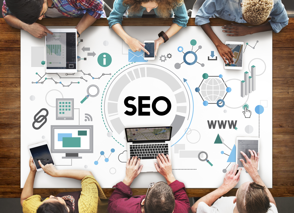 Group on table with SEO ultimate guide